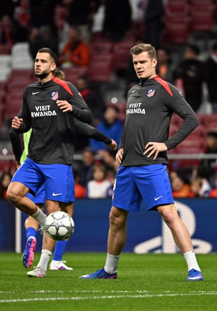 Atletico Madrid's Slovak defender #17 David Hancko (L) and Atletico Madrid's Norwegian forward #09 Alexander Sorloth warm up before the UEFA Champions League league phase day 8 football match between Club Atletico de Madrid and Bodoe/Glimt at Metropolitano Stadium in Madrid on January 28, 2026. (Photo by JAVIER SORIANO / AFP)