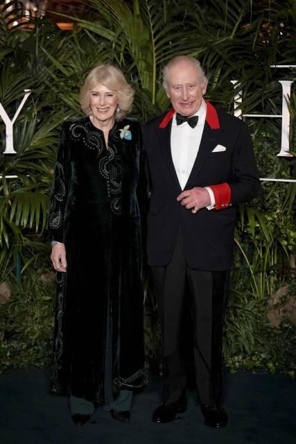 Britain's King Charles III and Britain's Queen Camilla pose upon arrival to attend the premiere of Prime Video's Finding Harmony: A King's Vision, at Windsor Castle in Windsor, on January 28, 2026. (Photo by Aaron Chown / POOL / AFP)