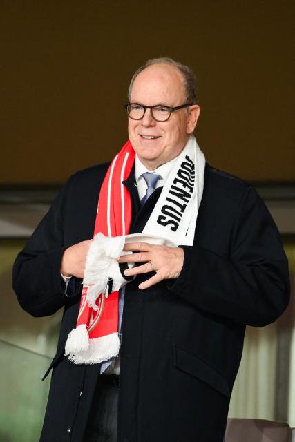 Prince Albert II of Monaco adjusts his scarf on the stands ahead of the UEFA Champions League league phase day 8 football match between AS Monaco and Juventus at the Stade Louis II in the Principality of Monaco on January 28, 2026. (Photo by FREDERIC DIDES / AFP)