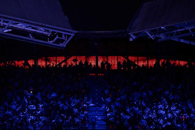 Supporters wave flags ahead of the UEFA Champions League league phase day 8 football match between PSV Eindhoven and Bayern Munich at Philips Stadion in Eindhoven on January 28, 2026. (Photo by JOHN THYS / AFP)
