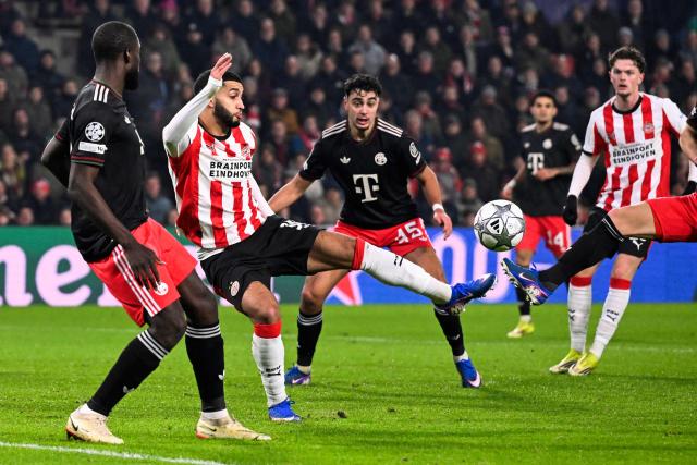 PSV Eindhoven's Moroccan midfielder #34 Ismael Saibari (2L) shoots the ball during the UEFA Champions League league phase day 8 football match between PSV Eindhoven and Bayern Munich at Philips Stadion in Eindhoven on January 28, 2026. (Photo by JOHN THYS / AFP)