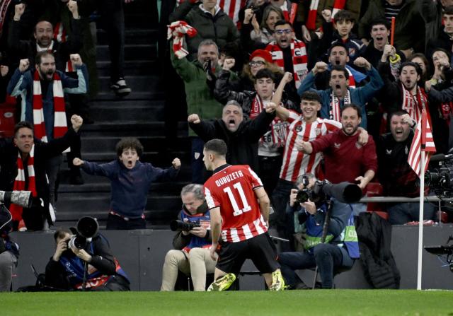 Athletic Bilbao's Spanish forward #11 Gorka Guruzeta celebrates with supporters scoring his team's second goal during the UEFA Champions League league phase day 8 football match between Athletic Club Bilbao and Sporting CP at San Mames Stadium in Bilbao on January 28, 2026. (Photo by ANDER GILLENEA / AFP)