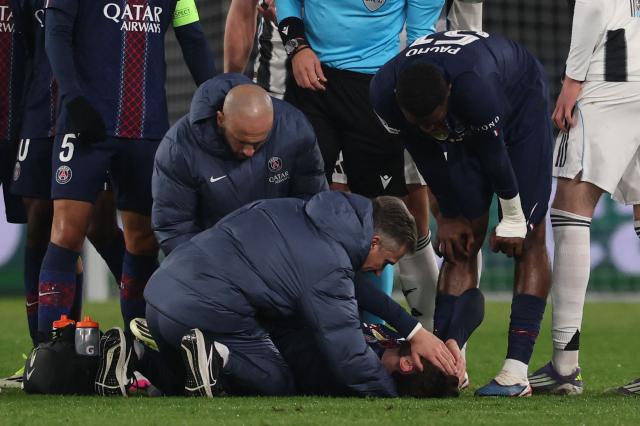 Paris Saint-Germain's Georgian forward #07 Khvicha Kvaratskhelia (down) receives medical assistance after an injury during the UEFA Champions League - League phase, Matchday 8 - football match between Paris Saint-Germain (PSG) and Newcastle United FC at the Parc des Princes stadium in Paris on January 28, 2026. (Photo by FRANCK FIFE / AFP)