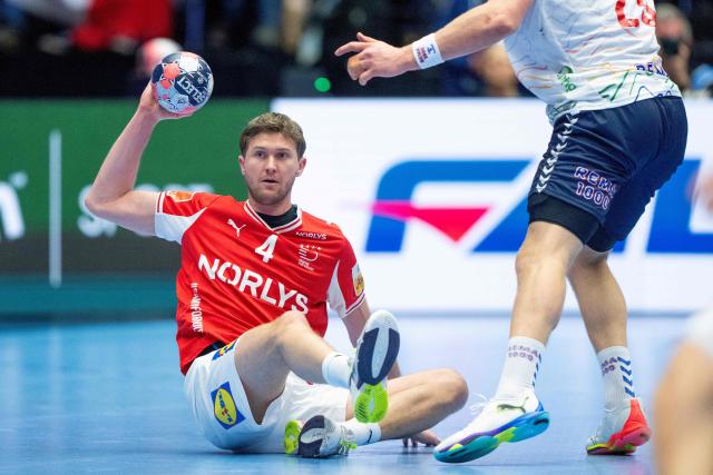 Denmark's wing #04 Magnus Landin captures the ball from Norway's pivot #25 Martin Hernes Hovde during the men's EHF Euro 2026 main round handball match Denmark vs Norway in Herning, Denmark, on January 28, 2026. (Photo by Bo Amstrup / Ritzau Scanpix / AFP) / Denmark OUT