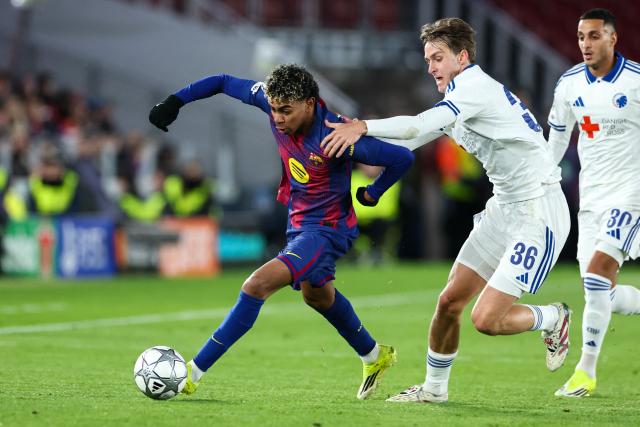 Barcelona's Spanish forward #10 Lamine Yamal (L) runs with the ball challenged by FC Copenhagen's Danish midfielder #36 William Clem during the UEFA Champions League league phase day 8 football match between FC Barcelona and FC Copenhagen at the Camp Nou Stadium in Barcelona on Janaury 28, 2026. (Photo by Josep LAGO / AFP)