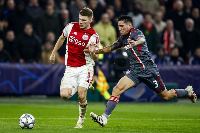 Ajax's Danish defender #03 Anton Gaaei (L) and Olympiakos' Argentine midfielder #03 Francisco Ortega (R) fight for the ball during the UEFA Champions League, league phase - matchday 8, football match between Ajax and Olympiakos at the Johan Cruijff Arena, in Amsterdam on January 28, 2026. (Photo by Koen van Weel / ANP / AFP) / Netherlands OUT