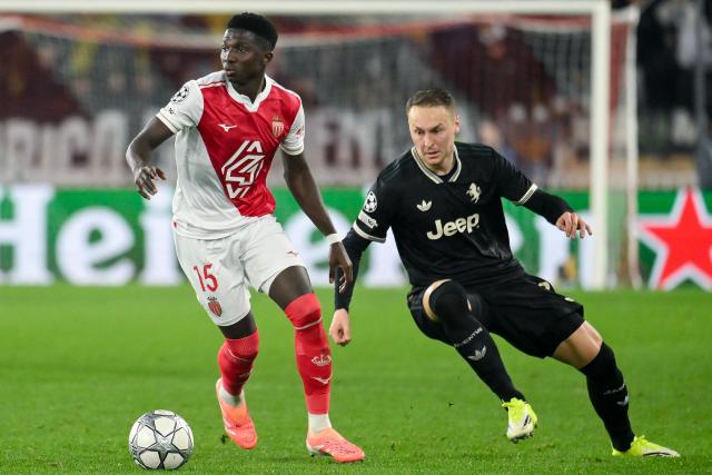 Monaco's Senegalese midfielder #15 Lamine Camara (L) fights for the ball with Juventus' Dutch midfielder #08 Teun Koopmeiners during the UEFA Champions League league phase day 8 football match between AS Monaco and Juventus at the Stade Louis II in the Principality of Monaco on January 28, 2026. (Photo by FREDERIC DIDES / AFP)