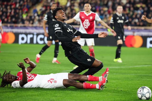 Monaco's French midfielder #28 Mamadou Coulibaly (DOWN) fights for the ball with Juventus' Colombian defender #32 J Cabal during the UEFA Champions League league phase day 8 football match between AS Monaco and Juventus at the Stade Louis II in the Principality of Monaco on January 28, 2026. (Photo by Valery HACHE / AFP)