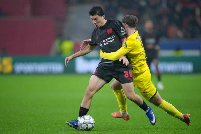 Bayer Leverkusen's Algerian midfielder #30 Ibrahim Maza (L) and Villarreal's Spanish defender #26 Pau Navarro vie for the ball during the UEFA Champions League league phase - Day 8 football match between Bayer Leverkusen and Villarreal CF at the BayArena stadium in Leverkusen, western Germany on January 28, 2026. (Photo by Pau Barrena / AFP)