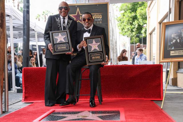 US singer-songwriters Ronald Isley (R) and Ernie Isley (L) of US band The Isley Brothers pose during their Hollywood Walk of Fame star ceremony in Hollywood, California on January 28, 2026. (Photo by VALERIE MACON / AFP)