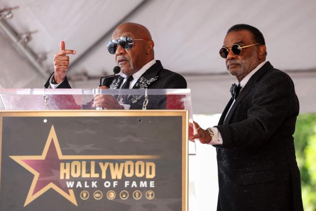US singer-songwriters Ernie Isley (L) and Ronald Isley of US band The Isley Brothers speak during their Walk of Fame ceremony in Hollywood, California on January 28, 2026. (Photo by VALERIE MACON / AFP)