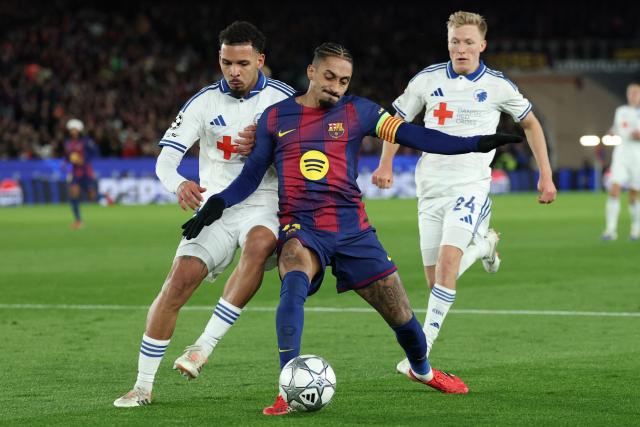 Barcelona's Brazilian forward #11 Raphinha (C) is challenged by FC Copenhagen's Brazilian defender #05 Gabriel Pereira and FC Copenhagen's Norwegian defender #24 Birger Meling (R) during the UEFA Champions League league phase day 8 football match between FC Barcelona and FC Copenhagen at the Camp Nou Stadium in Barcelona on Janaury 28, 2026. (Photo by Lluis GENE / AFP)