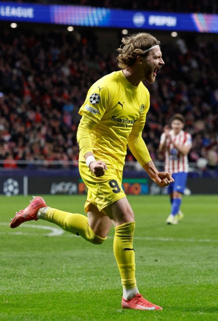 Bodoe/Glimt's Danish forward #09 Kasper Waarst Hogh celebrates scoring his team's second goal during the UEFA Champions League league phase day 8 football match between Club Atletico de Madrid and Bodoe/Glimt at Metropolitano Stadium in Madrid on January 28, 2026. (Photo by Oscar DEL POZO / AFP)