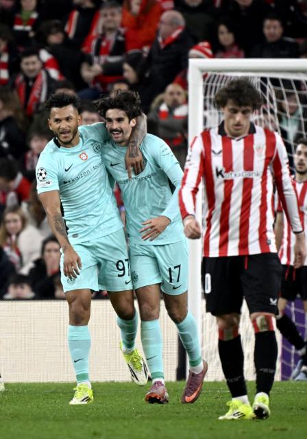 Sporting Lisbon's Portuguese forward #17 Francisco Trincao (C) celebrates with Sporting Lisbon's Colombian forward #97 Luis Suarez scoring his team's second goal during the UEFA Champions League league phase day 8 football match between Athletic Club Bilbao and Sporting CP at San Mames Stadium in Bilbao on January 28, 2026. (Photo by ANDER GILLENEA / AFP)