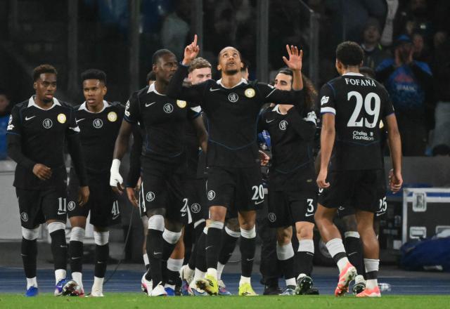 Chelsea's Brazilian striker #20 Joao Pedro celebrates scoring his team's second goal during the UEFA Champions League - league phase day 8 football match between Napoli and Chelsea at the Diego Armando Maradona stadium in Naples on January 28, 2026. (Photo by Alberto PIZZOLI / AFP)