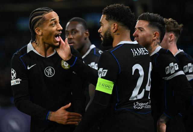 Chelsea's Brazilian striker #20 Joao Pedro celebrates with teammates after scoring his team's second goal during the UEFA Champions League - league phase day 8 football match between Napoli and Chelsea at the Diego Armando Maradona stadium in Naples on January 28, 2026. (Photo by Andreas SOLARO / AFP)