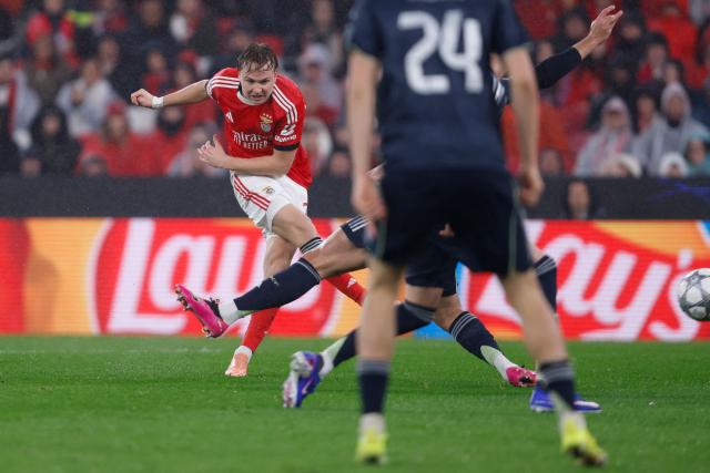 Benfica's Norwegian forward #21 Andreas Schjelderup kicks the ball and scores his team's third goal during the UEFA Champions League league phase day 8 football match between SL Benfica and Real Madrid CF at Estadio da Luz in Lisbon on January 28, 2026. (Photo by FILIPE AMORIM / AFP)