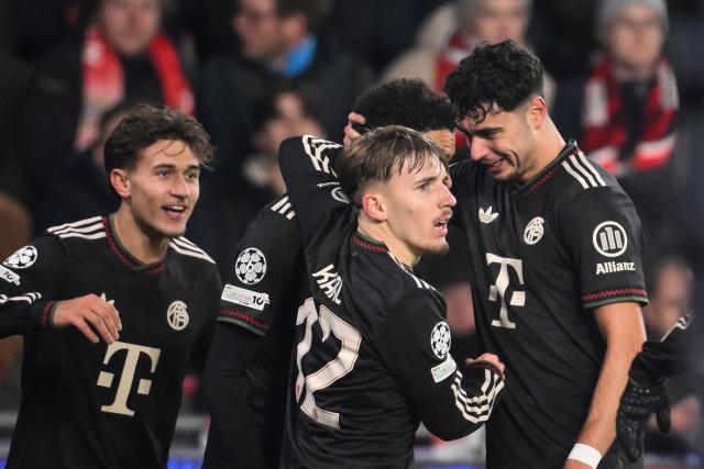 Bayern Munich's German midfielder #10 Jamal Musiala (unseen) celebrates after scoring his team's first goal with Bayern Munich's German midfielder #20 Tom Bischof (L), Bayern Munich's German midfielder #42 Lennart Karl (2R) and Bayern Munich's German midfielder #45 Aleksandar Pavlovic (R) during the UEFA Champions League league phase day 8 football match between PSV Eindhoven and Bayern Munich at Philips Stadion in Eindhoven on January 28, 2026. (Photo by JOHN THYS / AFP)