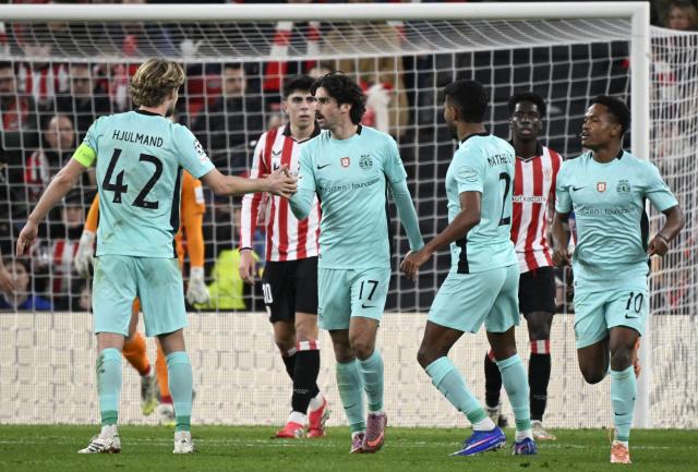Sporting Lisbon's Portuguese forward #17 Francisco Trincao (2L) celebrates scoring his team's second goal during the UEFA Champions League league phase day 8 football match between Athletic Club Bilbao and Sporting CP at San Mames Stadium in Bilbao on January 28, 2026. (Photo by ANDER GILLENEA / AFP)