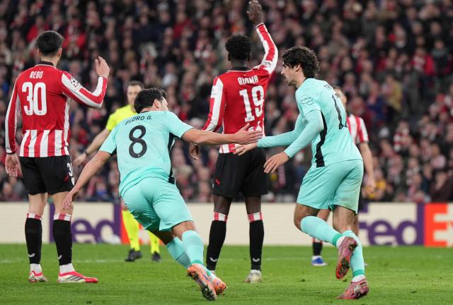 Sporting Lisbon's Portuguese forward #17 Francisco Trincao celebrates scoring his team's second goal with Sporting Lisbon's Portuguese forward #08 Pedro Goncalves during the UEFA Champions League league phase day 8 football match between Athletic Club Bilbao and Sporting CP at San Mames Stadium in Bilbao on January 28, 2026. (Photo by Cesar MANSO / AFP)