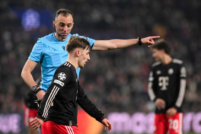 Portuguese referee Joao Pinheiro gestures as Bayern Munich's German midfielder #42 Lennart Karl is substituted during the UEFA Champions League league phase day 8 football match between PSV Eindhoven and Bayern Munich at Philips Stadion in Eindhoven on January 28, 2026. (Photo by JOHN THYS / AFP)