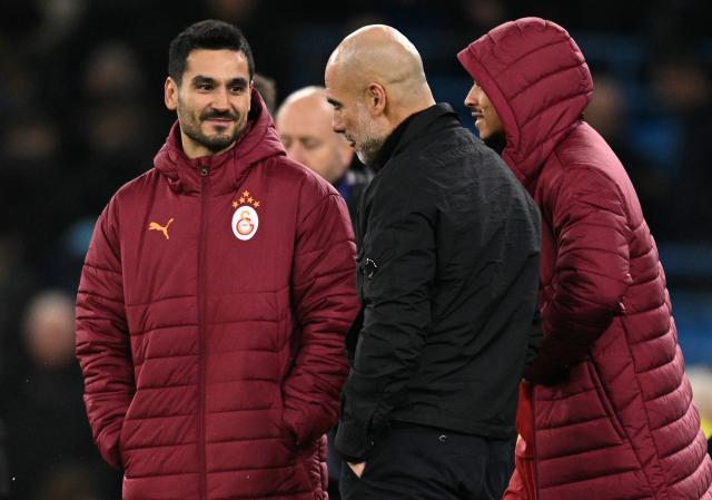 Manchester City's Spanish manager Pep Guardiola talks with Galatasaray's Turkish midfielder #20 Ilkay Gundogan and Galatasaray's German midfielder #10 Leroy Sane after the UEFA Champions League football match between Manchester City and Galatasaray at the Etihad Stadium in Manchester, north west England, on January 28, 2026. Manchester City won the match 2-0. (Photo by Oli SCARFF / AFP)