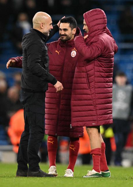 Manchester City's Spanish manager Pep Guardiola talks with Galatasaray's Turkish midfielder #20 Ilkay Gundogan and Galatasaray's German midfielder #10 Leroy Sane after the UEFA Champions League football match between Manchester City and Galatasaray at the Etihad Stadium in Manchester, north west England, on January 28, 2026. Manchester City won the match 2-0. (Photo by Oli SCARFF / AFP)