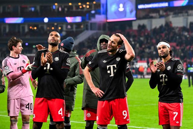(From L) Bayern Munich's German goalkeeper #40 Jonas Urbig, Bayern Munich's English defender #4 Jonathan Tah, Bayern Munich's English forward #09 Harry Kane and Bayern Munich's German forward #07 Serge Gnabry celebrate after winning the UEFA Champions League league phase day 8 football match between PSV Eindhoven and Bayern Munich at Philips Stadion in Eindhoven on January 28, 2026. (Photo by JOHN THYS / AFP)