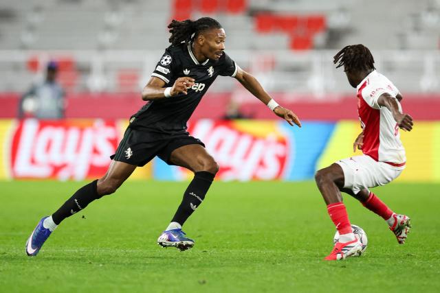 Juventus' French midfielder #19 Khephren Thuram-Ulien (L) fights for the ball during the UEFA Champions League league phase day 8 football match between AS Monaco and Juventus at the Stade Louis II in the Principality of Monaco on January 28, 2026. (Photo by Valery HACHE / AFP)