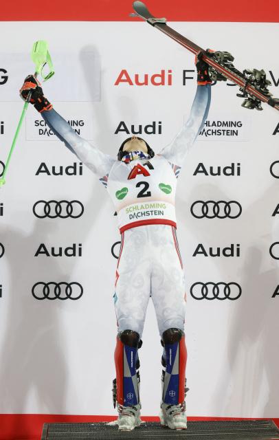 First placed Norway's Henrik Kristoffersen celebrates on the podium after winning the second run of the men's Slalom event of FIS Alpine Skiing World Cup in Schladming, Austria, on January 28, 2026. (Photo by ERWIN SCHERIAU / APA / AFP) / Austria OUT