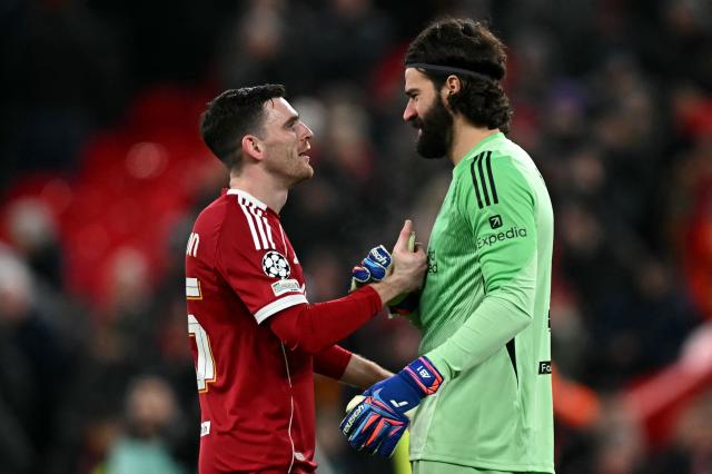 Liverpool's Scottish defender #26 Andrew Robertson (L) and Liverpool's Brazilian goalkeeper #01 Alisson Becker react following the UEFA Champions League football match between Liverpool and Qarabag at Anfield in Liverpool, north west England on January 28, 2026. (Photo by Paul ELLIS / AFP)