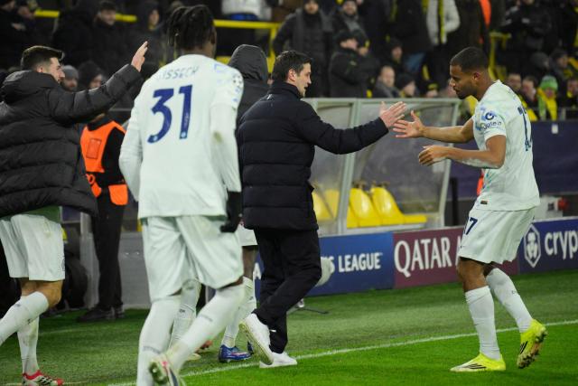Inter Milan's French midfielder #17 Andy Diouf (R) celebrates with Inter Milan's Romanian head coach Cristian Chivu (2nd R) after scoring the 0-2 goal during the UEFA Champions League league phase - day 8 football match between BVB Borussia Dortmund and Inter Milan in Dortmund, western Germany, on January 28, 2026. (Photo by Sascha Schuermann / AFP)