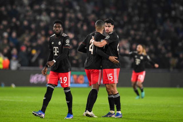 Bayern Munich's Canadian defender #19 Alphonso Davies (L) and Bayern Munich's German midfielder #45 Aleksandar Pavlovic (R) celebrate after winning the UEFA Champions League league phase day 8 football match between PSV Eindhoven and Bayern Munich at Philips Stadion in Eindhoven on January 28, 2026. (Photo by JOHN THYS / AFP)
