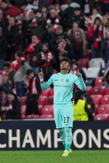 Sporting Lisbon's Brazilian forward #27 Alisson Santos celebrates victory at the end of the UEFA Champions League league phase day 8 football match between Athletic Club Bilbao and Sporting CP at San Mames Stadium in Bilbao on January 28, 2026. (Photo by Cesar MANSO / AFP)
