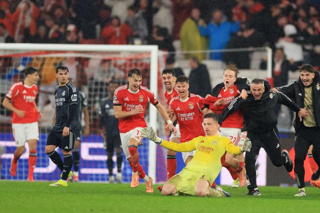 Benfica's Ukrainian goalkeeper #01 Anatoliy Trubin celebrates after scoring his team's fourth goal during the UEFA Champions League league phase day 8 football match between SL Benfica and Real Madrid CF at Estadio da Luz in Lisbon on January 28, 2026. (Photo by PATRICIA DE MELO MOREIRA / AFP)