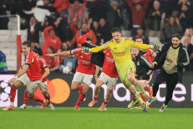 Benfica's Ukrainian goalkeeper #01 Anatoliy Trubin celebrates after scoring his team's fourth goal during the UEFA Champions League league phase day 8 football match between SL Benfica and Real Madrid CF at Estadio da Luz in Lisbon on January 28, 2026. (Photo by PATRICIA DE MELO MOREIRA / AFP)