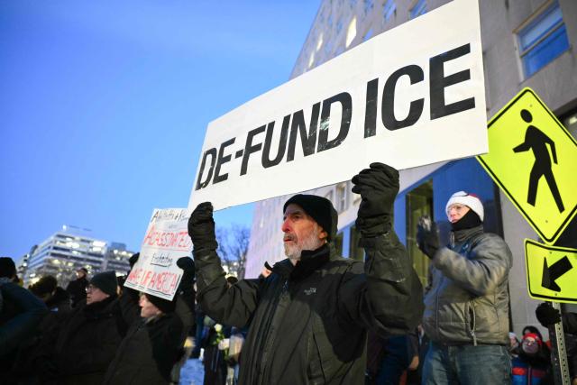 Activists take part in a vigil for Alex Pretti outside of the US Department of Veteran Affairs in Washington, DC on January 28, 2026. Pretti, an intensive care nurse for the Department of Veterans Affairs, was killed on January 24, 2026 by federal agents in Minneapolis, Minnesota. US President Donald Trump said on January 27 that he would "de-escalate a little bit" in Minneapolis after the fatal shootings of two civilians fueled a storm of criticism over his signature immigration crackdown. Trump's "border czar" Tom Homan met with officials in the city as the Republican attempted damage control after the killing by immigration agents of Pretti on January 24. (Photo by Mandel NGAN / AFP)