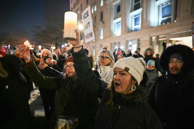 Activists take part in a vigil for Alex Pretti outside of the US Department of Veteran Affairs in Washington, DC on January 28, 2026. Pretti, an intensive care nurse for the Department of Veterans Affairs, was killed on January 24, 2026 by federal agents in Minneapolis, Minnesota. US President Donald Trump said on January 27 that he would "de-escalate a little bit" in Minneapolis after the fatal shootings of two civilians fueled a storm of criticism over his signature immigration crackdown. Trump's "border czar" Tom Homan met with officials in the city as the Republican attempted damage control after the killing by immigration agents of Pretti on January 24. (Photo by Mandel NGAN / AFP)