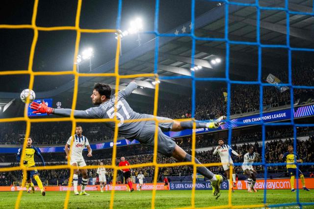 Atalanta's Italian goalkeeper #57 Marco Sportiello (C) dives for the ball during the UEFA Champions League, league phase day 8, football match between Club Brugge KV and Olympique de Marseille, at the Jan Breydel Stadium in Bruges on January 28, 2026. (Photo by JASPER JACOBS / BELGA / AFP) / Belgium OUT