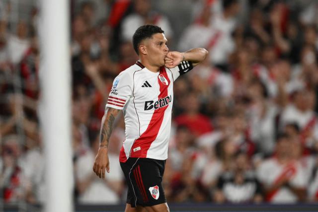 River Plate's fans cheer for their team during the Argentine Professional Football League 2026 Apertura Tournament match between River Plate and Gimnasia y Esgrima La Plata at the Mas Monumental Stadium in Buenos Aires on January 28, 2026. (Photo by Luis ROBAYO / AFP)