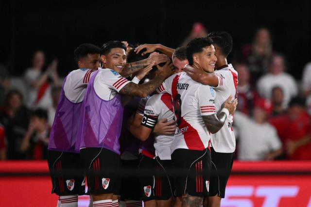 River Plate's Colombian midfielder #10 Juan Fernando Quintero (C) celebrates with teammates after scoring his team’s second goal during the Argentine Professional Football League 2026 Apertura Tournament match between River Plate and Gimnasia y Esgrima La Plata at the Mas Monumental Stadium in Buenos Aires on January 28, 2026. (Photo by Luis ROBAYO / AFP)