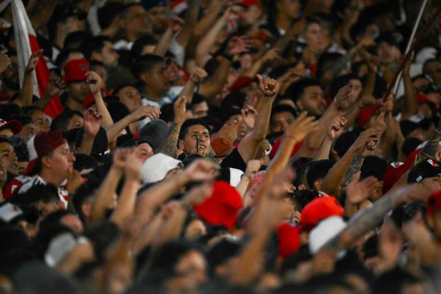 River Plate's fans cheer for their team during the Argentine Professional Football League 2026 Apertura Tournament match between River Plate and Gimnasia y Esgrima La Plata at the Mas Monumental Stadium in Buenos Aires on January 28, 2026. (Photo by Luis ROBAYO / AFP)