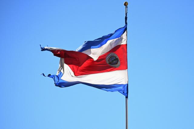 A Costa Rica’s flag flutters at the National Museum in San Jose on January 28, 2026. Right-wing politician Laura Fernandez appears set to win Costa Rica's presidential election in the first round, according to two opinion polls published on January 21. (Photo by Marvin RECINOS / AFP)
