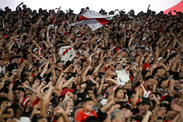 River Plate's fans cheer for their team during the Argentine Professional Football League 2026 Apertura Tournament match between River Plate and Gimnasia y Esgrima La Plata at the Mas Monumental Stadium in Buenos Aires on January 28, 2026. (Photo by Luis ROBAYO / AFP)