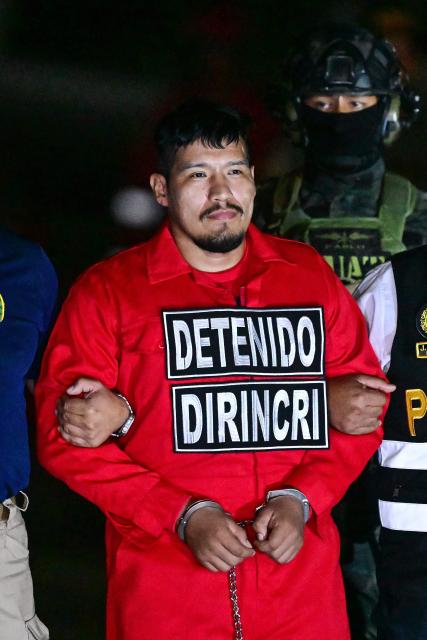 Erick Moreno Hernandez, known as ‘The Monster,’ arrives after being extradited from Paraguay at the Police Aviation Directorate (DIRAVPOL) in Collao, Peru, on January 28, 2026. One of the main leaders of an organization dedicated to extortion and contract killings in Peru arrived in Lima on January 28, extradited from Paraguay to serve a 32-year sentence, an AFP journalist reported. Erick Moreno, leader of ‘Los Injertos del Cono Norte,’ had been imprisoned in Asunciуn since last September, when Paraguayan authorities captured him after a three-year manhunt. (Photo by Connie FRANCE / AFP)