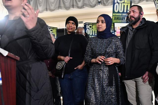 Rep. Ayanna Pressley (L), Democrat from Massachusetts, and Rep. Ilhan Omar (R), Democrat from Minnesota, look on with their security during a press conference in Minneapolis, Minnesota, on January 28, 2026. On January 27, 2026, a man sprayed Omar with a syringe of unknown liquid at a town hall meeting, where she called for curbing the Trump administration's anti-immigration crackdown. (Photo by Octavio JONES / AFP)