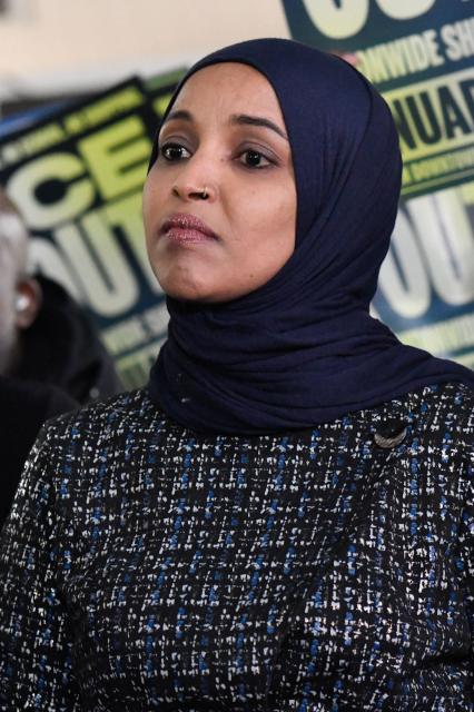 Rep. Ilhan Omar, Democrat from Minnesota, looks on during a press conference in Minneapolis, Minnesota, on January 28, 2026. On January 27, 2026, a man sprayed Omar with a syringe of unknown liquid at a town hall meeting, where she called for curbing the Trump administration's anti-immigration crackdown. (Photo by Octavio JONES / AFP)