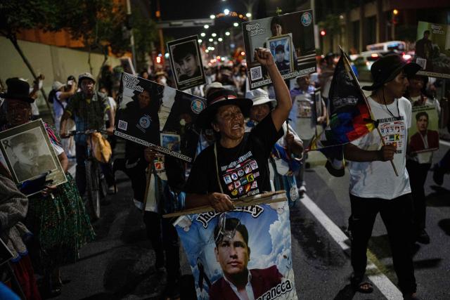 Relatives of the victims take part in a protest march called by Generation Z demanding the resignation of President Jeri in Lima on January 28, 2026. Peru's interim president, Jose Jeri, said on January 21 that he is the victim of a plot to force his resignation, in an appearance before a congressional committee investigating him for alleged influence peddling over a secret meeting with a Chinese businessman. (Photo by Ernesto BENAVIDES / AFP)