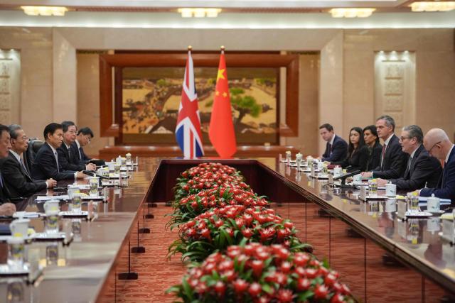 Britain's Prime Minister Keir Starmer (2nd R), speaks with Zhao Leji, Chairman of the Standing Committee of China’s National People’s Congress (NPC) (2nd L), during their meeting at the Great Hall of the People in Beijing on January 29, 2026. Starmer arrived on January 28 for the first visit by a British prime minister to China since 2018, seeking to promote what he called "pragmatic" partnership with the Asian giant after years of fraught relations. (Photo by Kin Cheung / POOL / AFP)