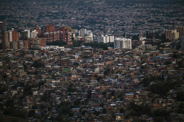 This view shows the western side of the city of Cali, Colombia, on January 28, 2026. Santiago de Cali, often referred to as Cali, is the capital of Colombia's Valle del Cauca department and the country's third-largest city. (Photo by JOAQUIN SARMIENTO / AFP)